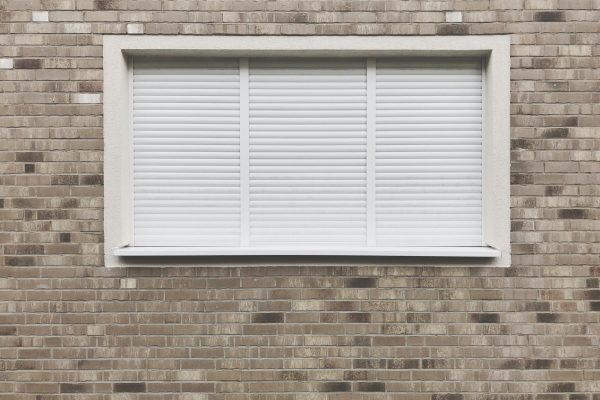 Window with closed roller shutter blinds